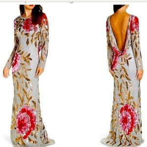Gorgeous formal gown. Beading throughout with large floral pattern